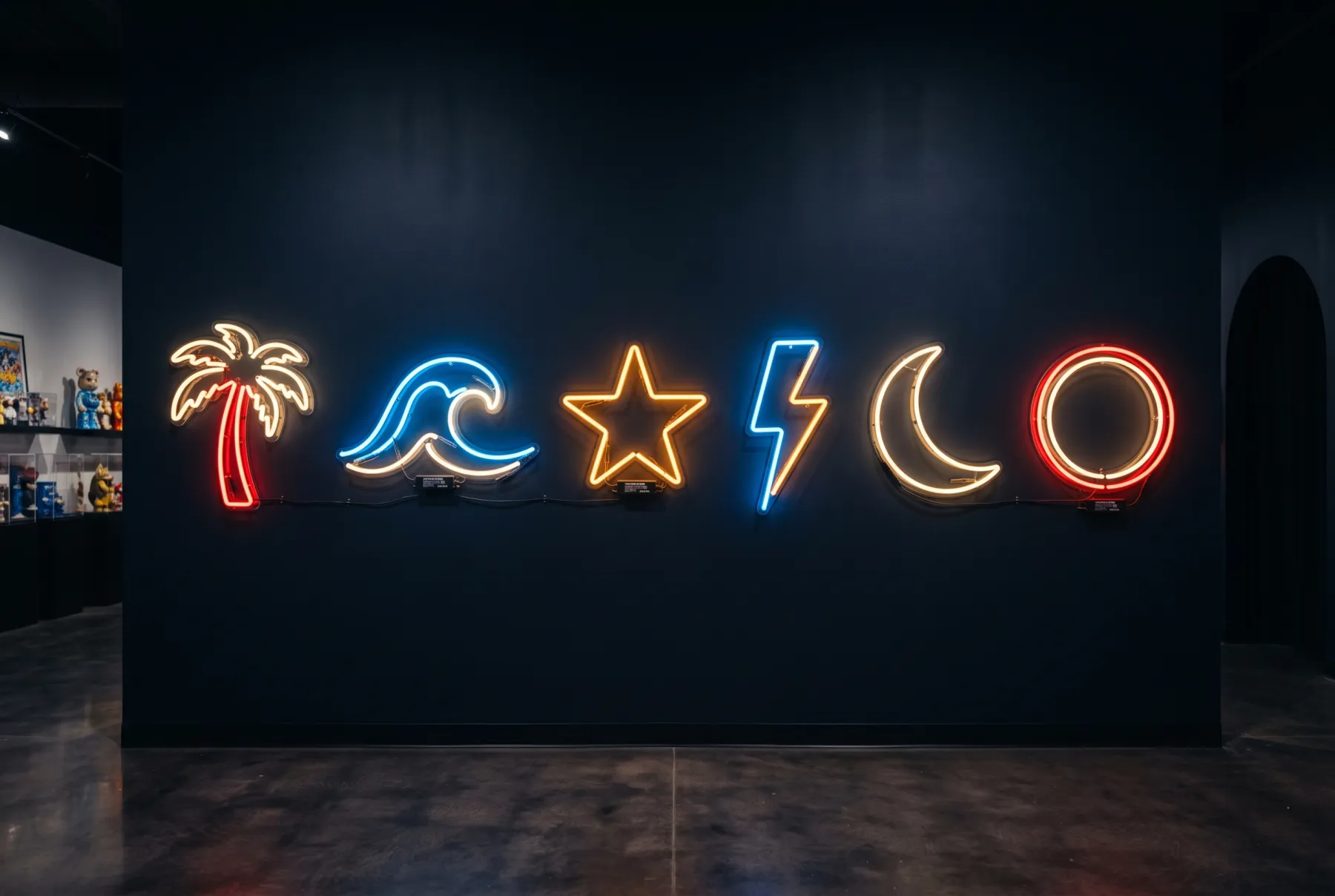 Vintage neon signs hung like a gallery on a dark wall